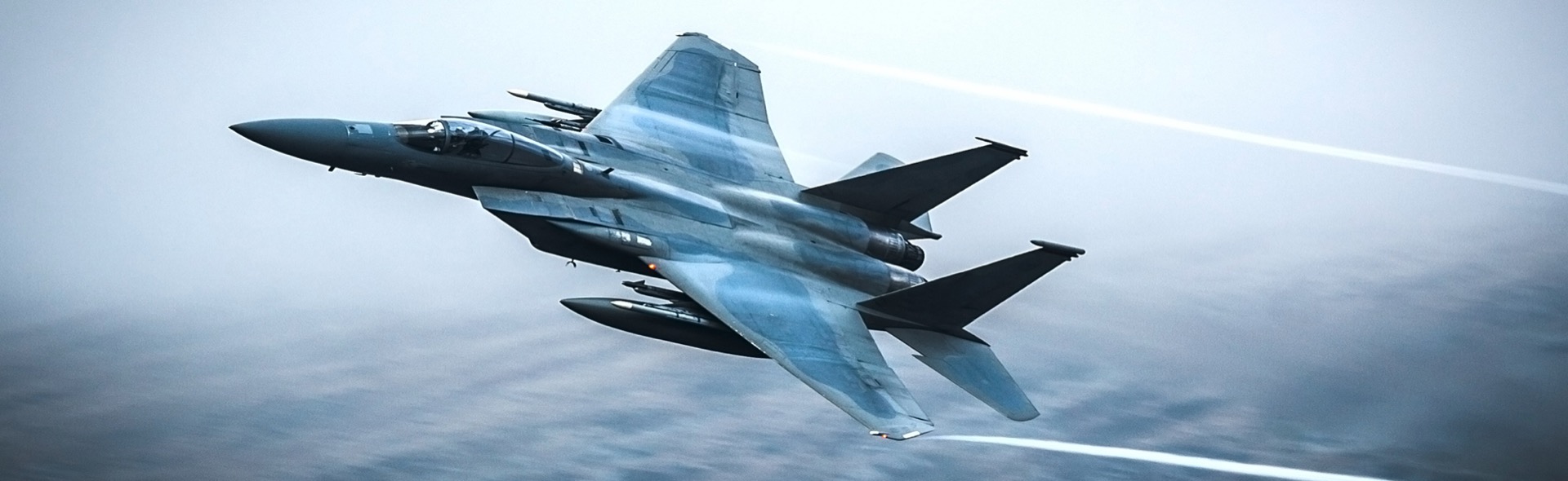 Stock photo of a fighter jet banking in flight